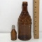 Pair of Vintage Brown Embossed Bottles