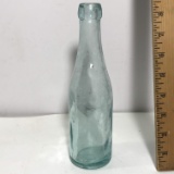 Blue Tint Bottle with Embossed Guy on Bottom