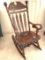 Vintage Heavy Wooden Rocking Chair with Ornately Carved Top