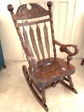Vintage Heavy Wooden Rocking Chair with Ornately Carved Top