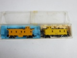 Orange & Yellow N Scale Cabooses