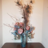 Faux Flowers and Peacock Feathers in Glass Vase
