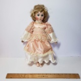 Vintage Porcelain Doll with Peach Silk Dress