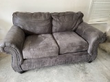 Charcoal Loveseat with Decorative Brads by Ashley Furniture