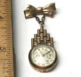 Vintage Gold Tone Dangling Watch Pin with Bow Charm