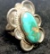 Pretty Silver Tone Ring with Large Turquoise Colored Stone