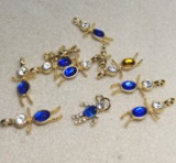 Lot of People Birthstone Charms - Sapphire and Topaz