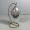 Egg with Glass Swans and Flowers Inside On Stand