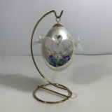Egg with Glass Swans and Flowers Inside On Stand