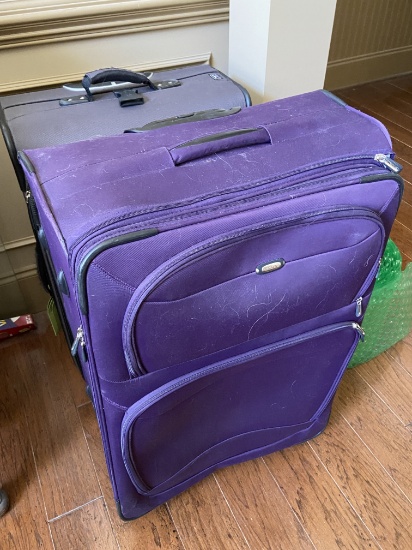 Pair of Large Rolling Suitcases