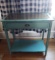 Wood Turquoise Tone Console Table with Glass Top & Distressed Look