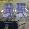 Matching Pair Red, White, and Blue Web Metal Folding Chairs