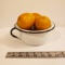 White Enamelware Bowl with Black Trim, Filled with Faux Lemons