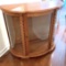 Lighted Oak Curio Cabinet with Curved Glass Front & Rope Accent