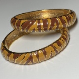 Pair of Gold Tone Enamel Tiger Stripe Hinged Bracelets