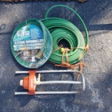 Lot of 2 25 Foot Sprinkler Hoses and Everain Sprinkler