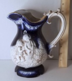 Italian Pottery Pitcher with Embossed Children