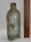 Early Green Tinted Medicine Bottle by R. V. Pierce, M.D.