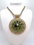 Gold Tone Large Pendant with Green Stones on Gold Tone Chain