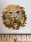 Gold Tone Lion Head Brooch with Clear & Green Stones