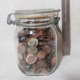 Glass Jar Filled with Assorted Change and Marbles