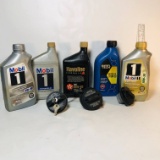 Lot of Motor Oil Partially Filled Bottles and Gas Caps