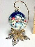 2004 “The Snow Team” Hand Painted Ornament on Stand Signed by Artist Marie Davis