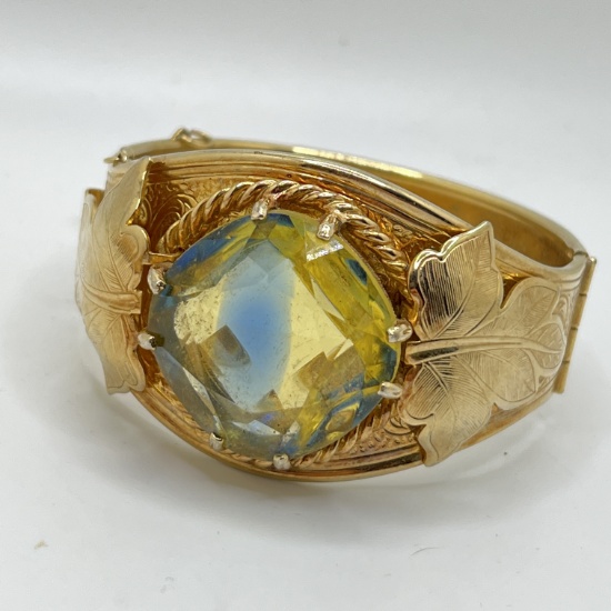 Gold Tone Hinged Signed Sarah Coventry Bracelet with Light Colored Stone & Leaf Appliques