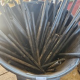 Trash Can Filled with Assorted Size Metal Porch Railing Pickets