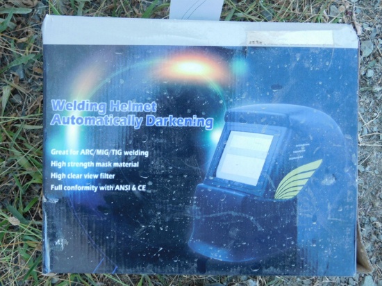 NEW & UNUSED DARKENING WELDING HELMET