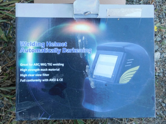 NEW & UNUSED DARKENING WELDING HELMET