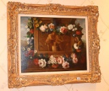 Floral painting in ornate gold frame