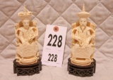Pair of carved oriental figurines