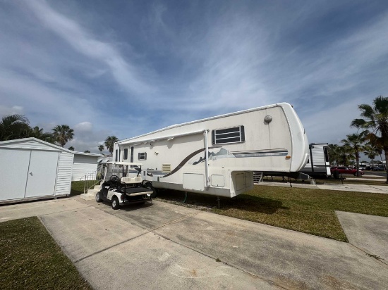 Travel Trailer & EZGO Golf Cart