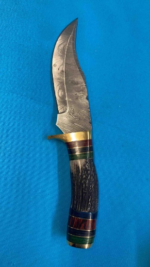 Handmade Damascus steel knives with either custom wood, bone, or resin handles