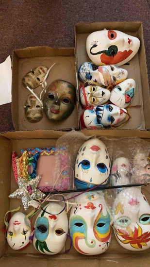 three flats of decorative wall hanging masks, 3 are metal enameled masks