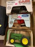 THREE ERTL Ford eight in tractor case L tractor John Deere tractor