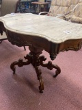 antique carved marble top Victorian table , 31 inches by 39 inches