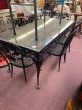 heavy wrought iron and glass top table with 6 chairs
