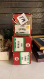 three boxes of toy train tracks