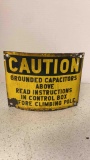 old curved steel sign caution grounded capacitor