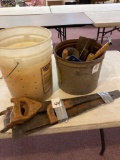 One bucket of corner brackets one bucket of trowels Old hand saws