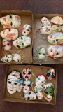 three flats of decorative wall hanging masks