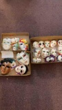 three flats of decorative wall hanging masks