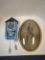 Studebaker wall hanging cuckoo clock and vintage boy on bike picture framed oval frame