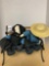 Cast iron and wooden bench with stuffed man and woman dolls sitting together