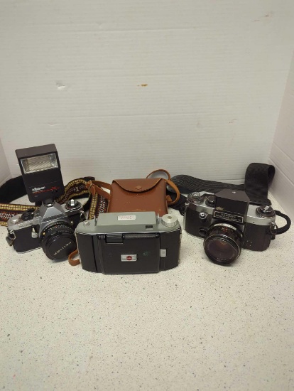 3 vintage cameras- Pentax-a 1:17, Kodak tourist II with case and hanimex prakyica super TL
