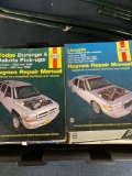 two totes of repair manuals
