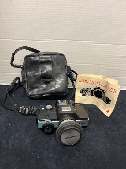 Vintage Minolta 110 Zoom SLR camera with case and owners manual