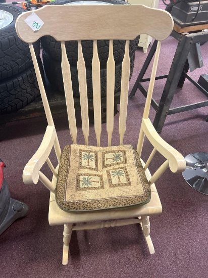 Wooden rocking chair with cushion
